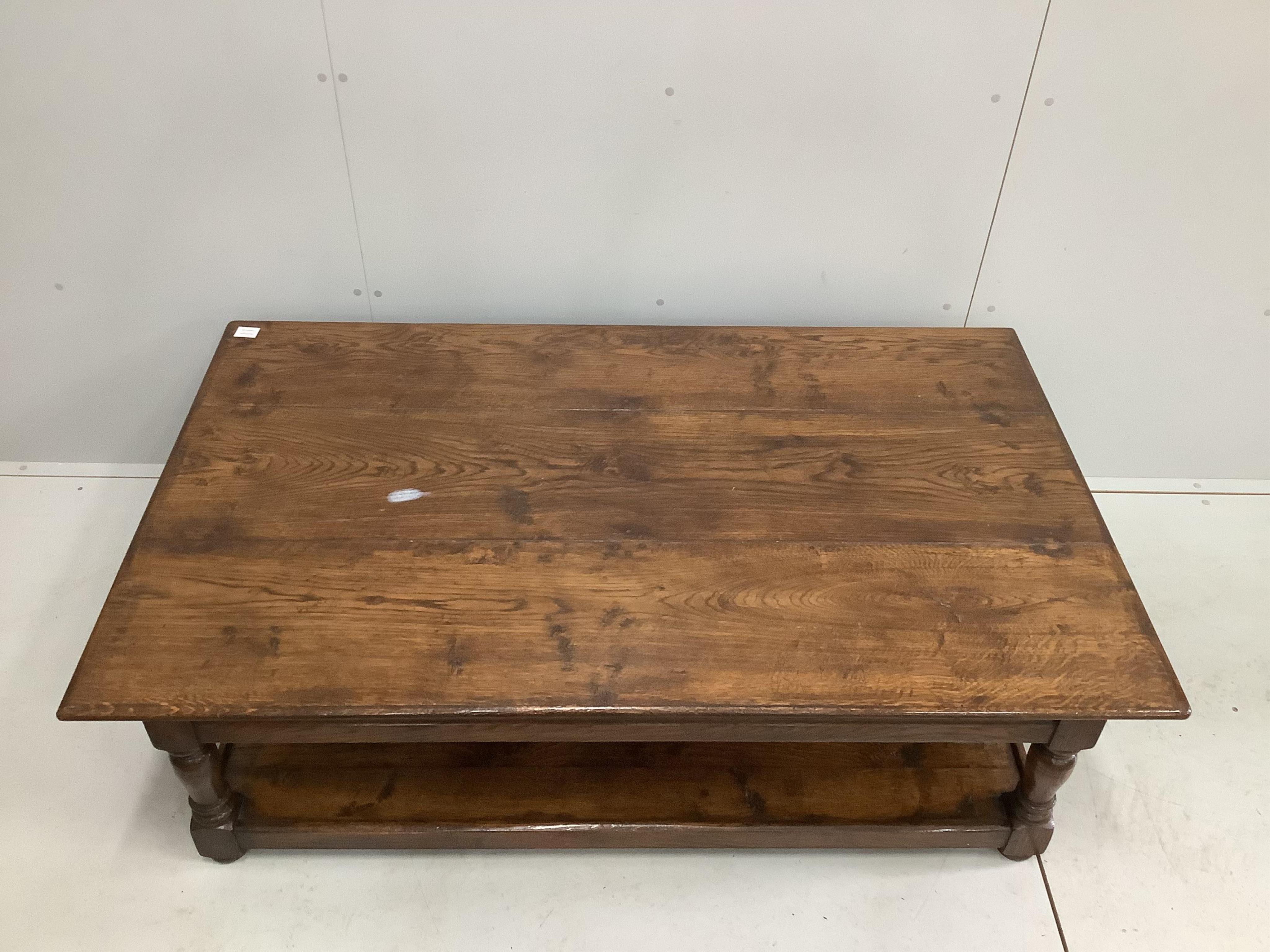 A large reproduction rectangular oak two tier coffee table, width 152cm, depth 92cm, height 49cm. Condition - good